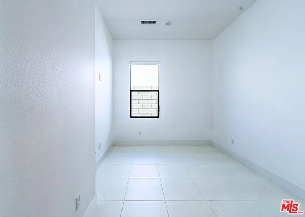 a bathroom with a sink a shower and a mirror
