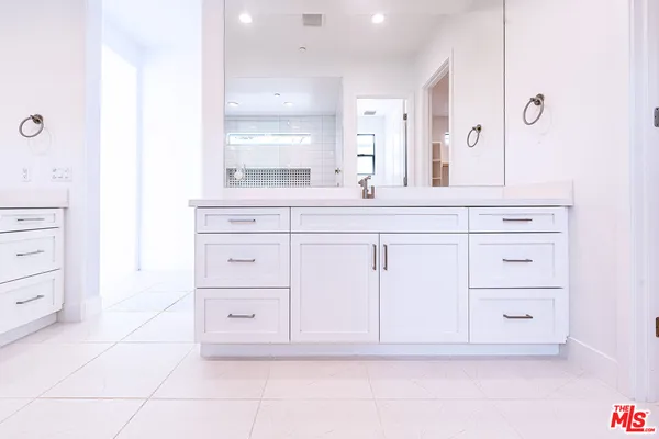 a view of an empty room with a bathroom