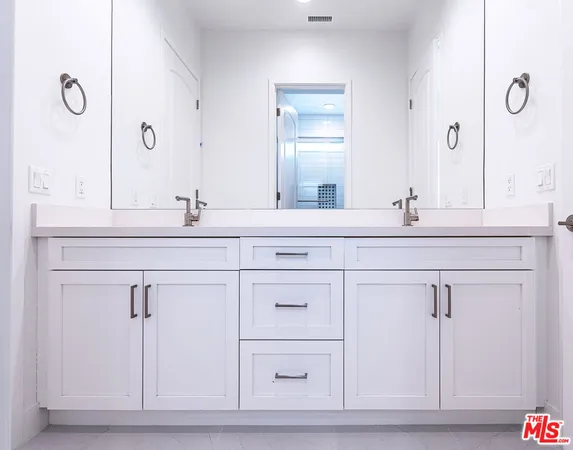 a view of a kitchen from the hallway