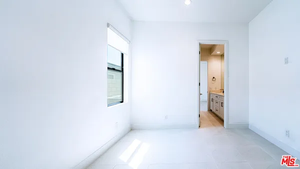 a bathroom with a granite countertop shower