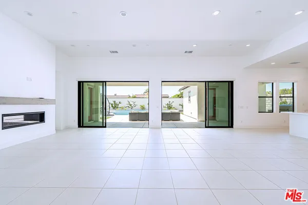 a view of a backyard with sitting area