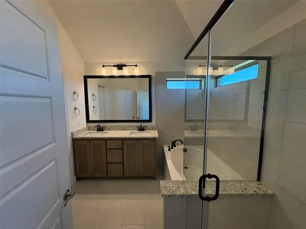 a kitchen with a refrigerator and a table