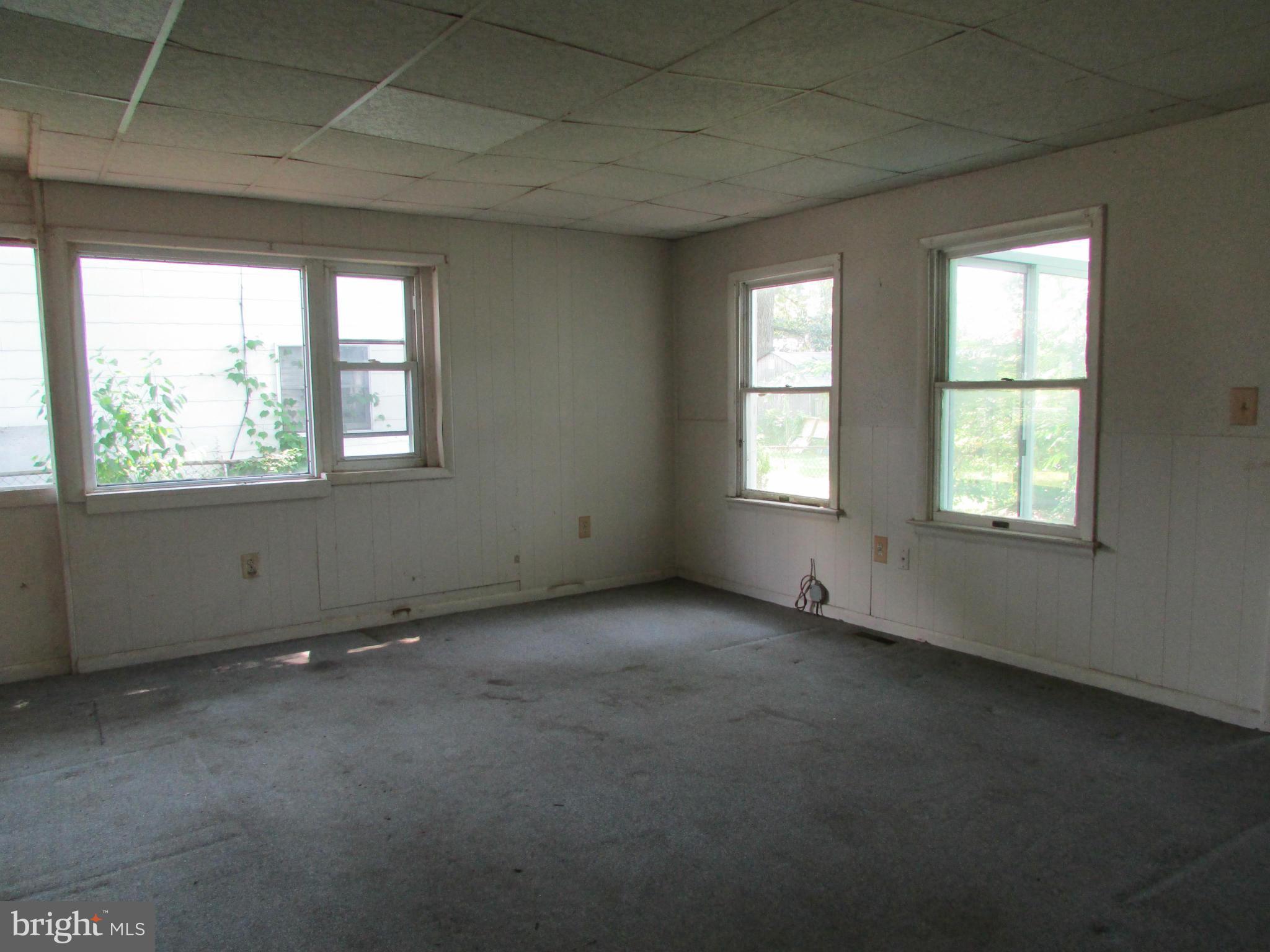 1416 2nd Road Baltimore, MD 21220 - Photo 3 of 11 an empty room with a window