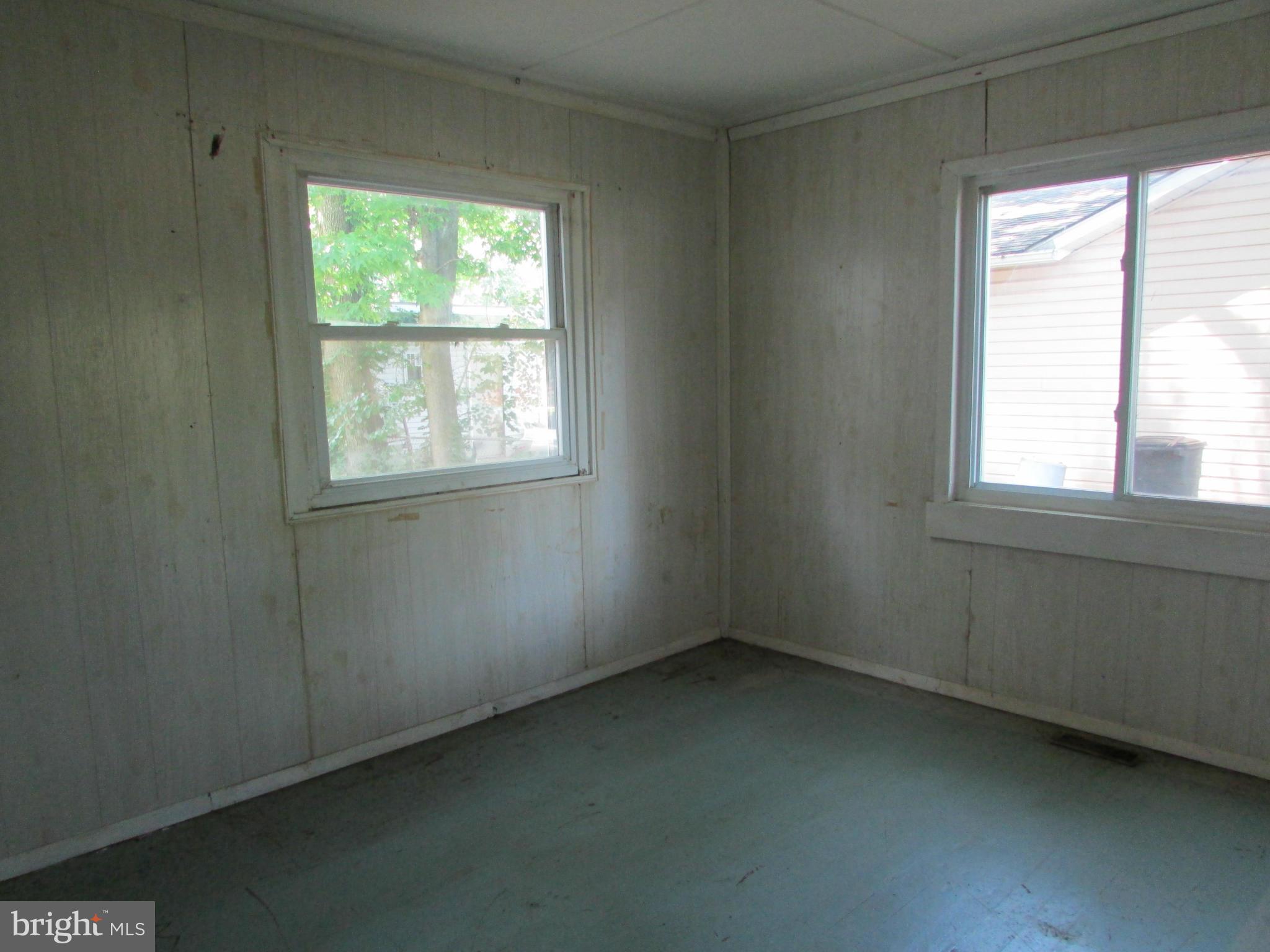 1416 2nd Road Baltimore, MD 21220 - Photo 7 of 11 an empty room with a window