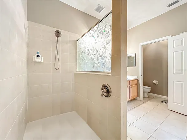 a view of storage and utility room with washer and dryer