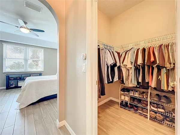 a view of a balcony with furniture and a floor to ceiling window