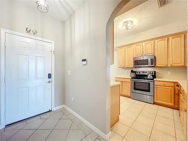 a kitchen with a stove a sink and a microwave