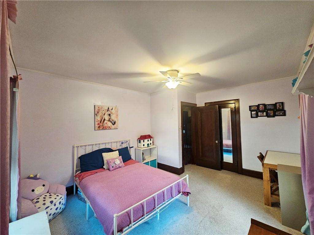 175 Blackfield Road Garrett, PA 15542 - Photo 18 of 37 a bedroom with a bed and a chandelier