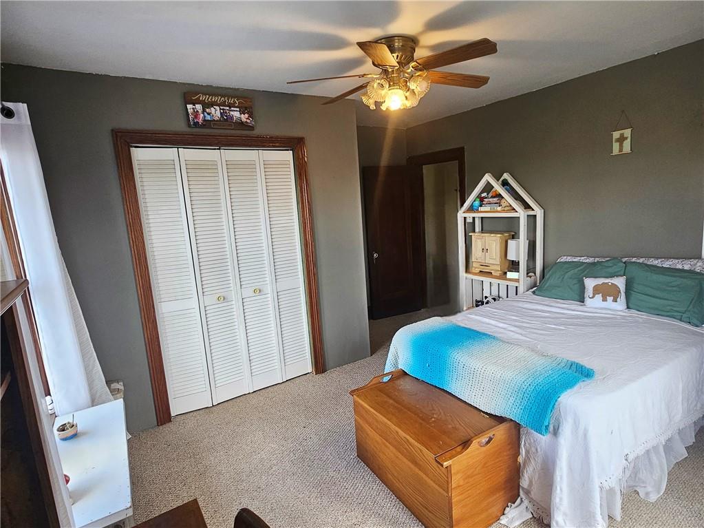 175 Blackfield Road Garrett, PA 15542 - Photo 19 of 37 a bedroom with a bed and a chandelier