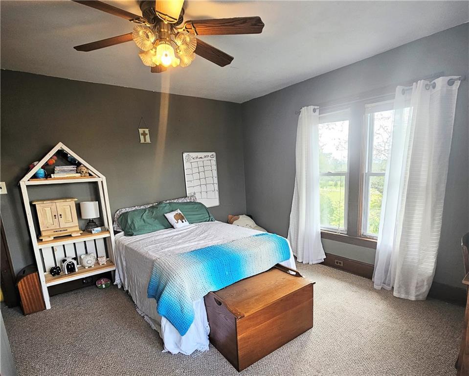 175 Blackfield Road Garrett, PA 15542 - Photo 20 of 37 a bedroom with a bed and a chandelier