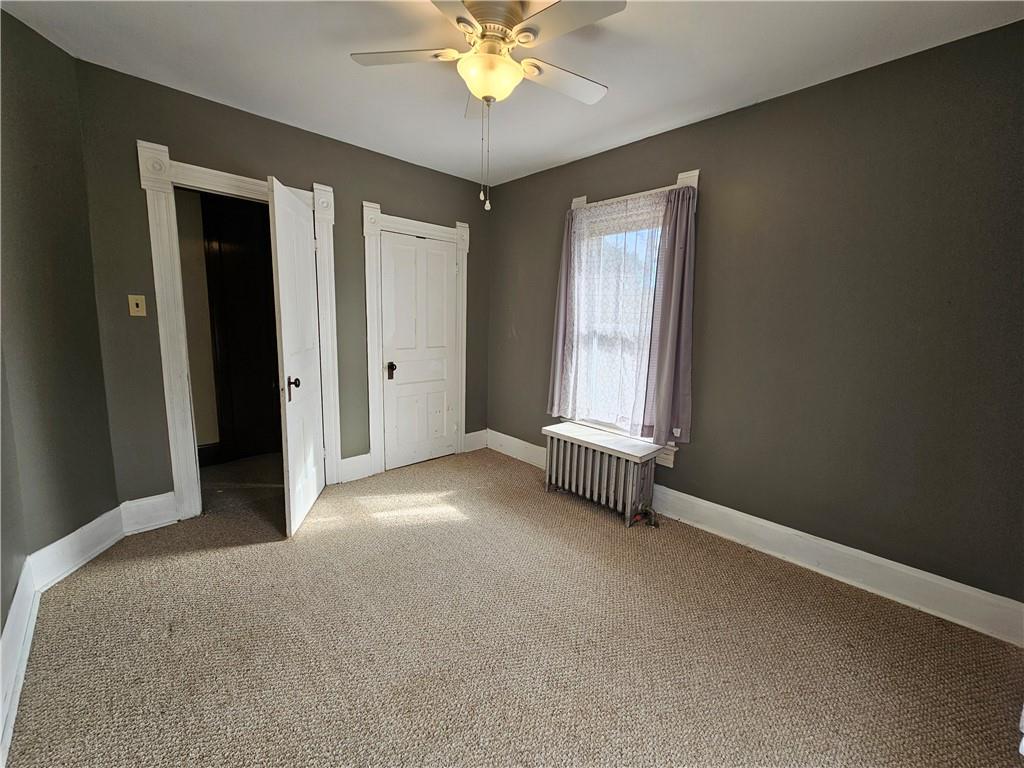 175 Blackfield Road Garrett, PA 15542 - Photo 22 of 37 an empty room with chandelier fan and windows