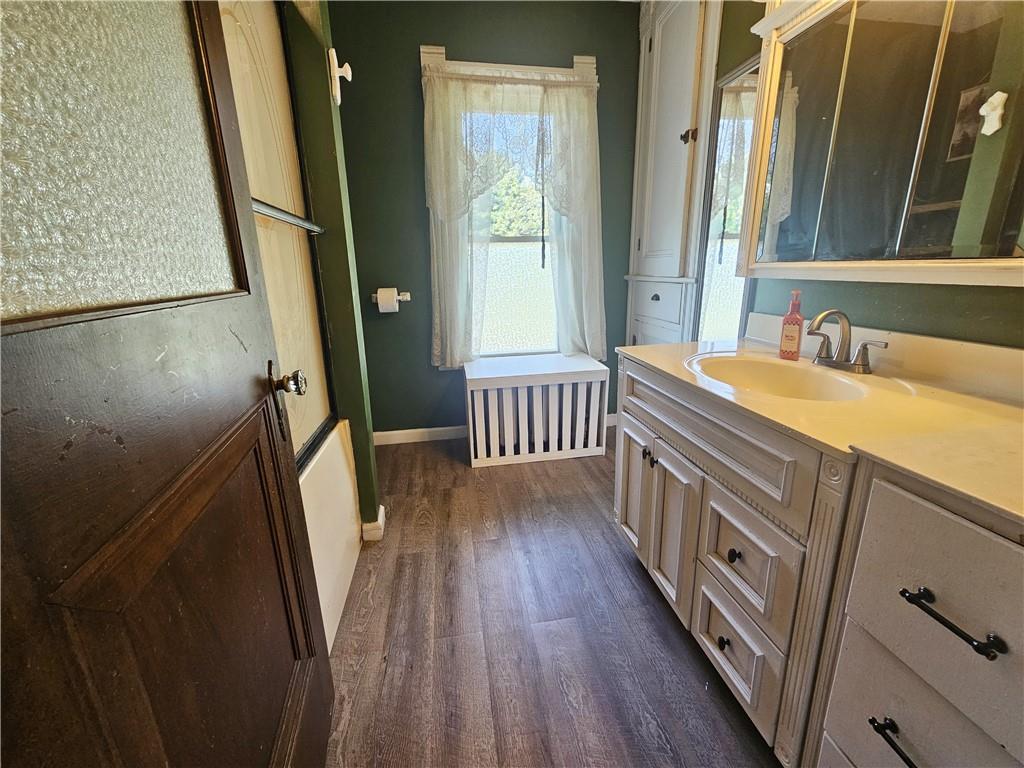 175 Blackfield Road Garrett, PA 15542 - Photo 24 of 37 a bathroom with a sink a mirror a bathtub and a shower