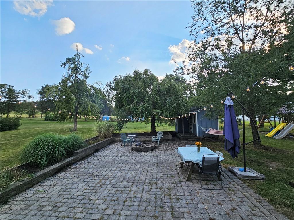 175 Blackfield Road Garrett, PA 15542 - Photo 31 of 37 a backyard of a house with fountain table and chairs