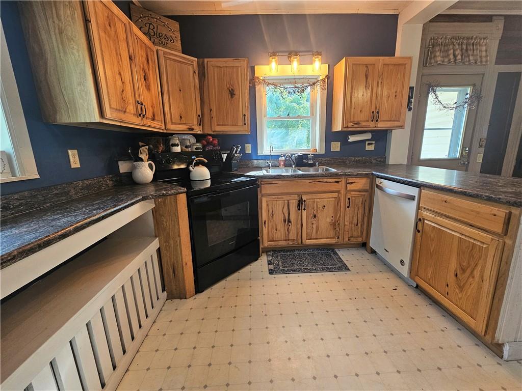 175 Blackfield Road Garrett, PA 15542 - Photo 6 of 37 a kitchen with stainless steel appliances granite countertop a stove a sink and a microwave