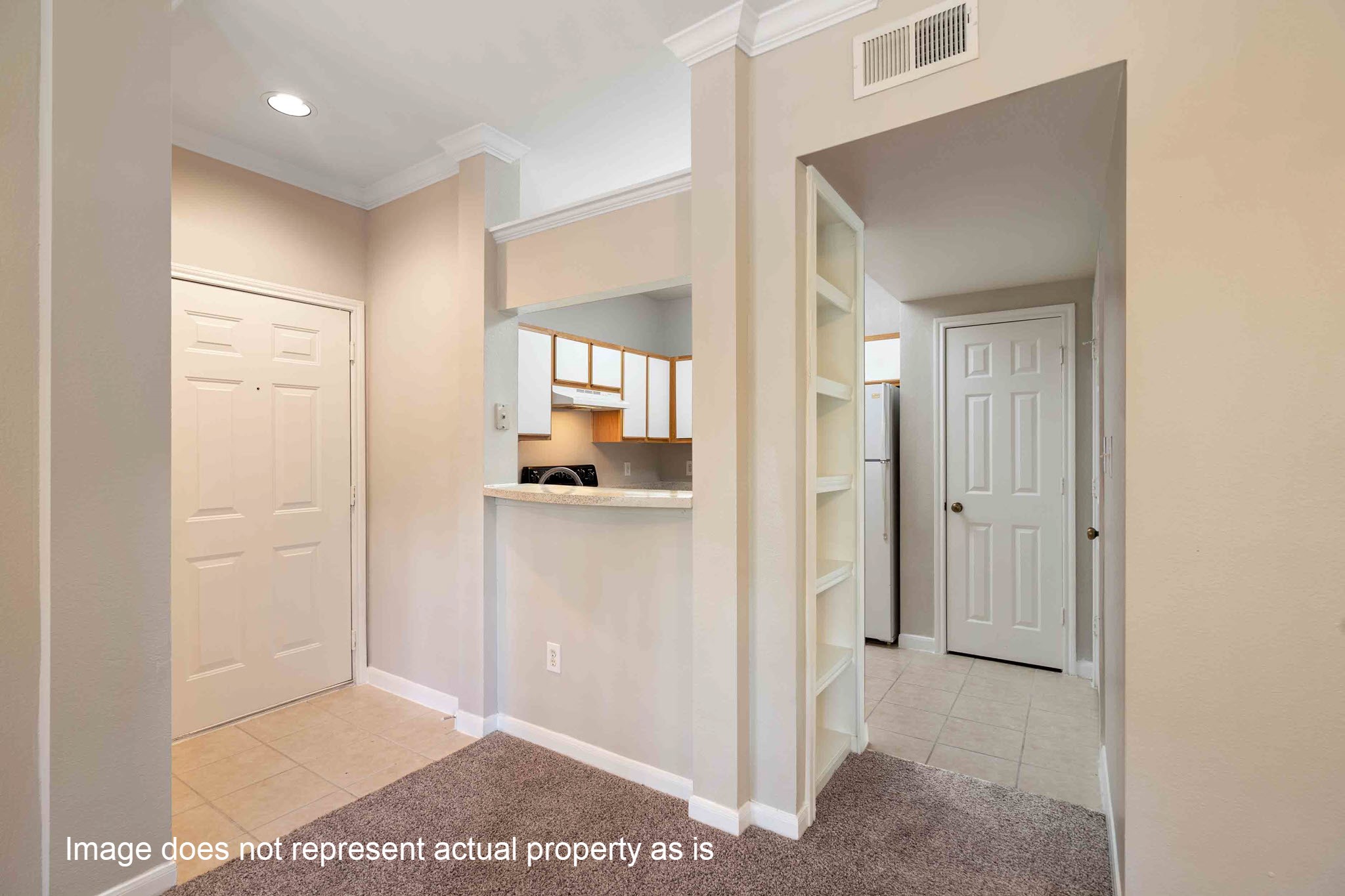 2400-625 Spring Rain Drive Spring, TX 77379 - Photo 6 of 36 a view of a hallway with a white cabinet and a living room