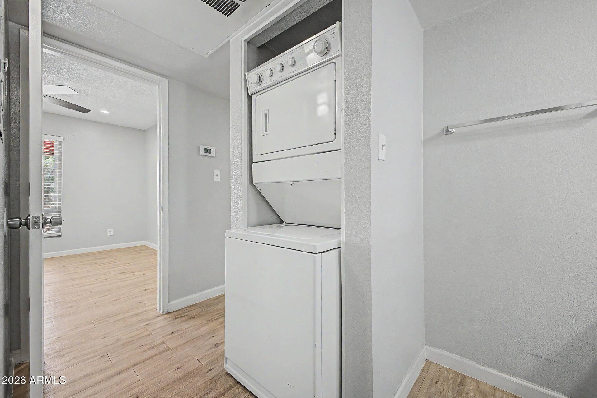 2625 East Indian School Road, Unit 227 Phoenix, AZ 85016 - Photo 19 of 31 a utility room with closet and wooden floor