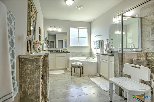 a bathroom with a sink toilet and mirror