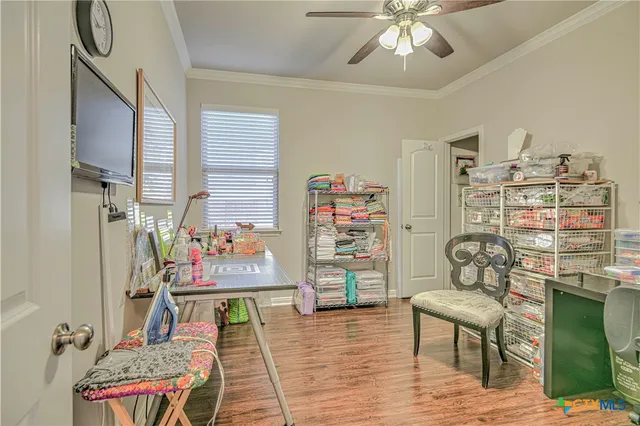 a bedroom with furniture and a window
