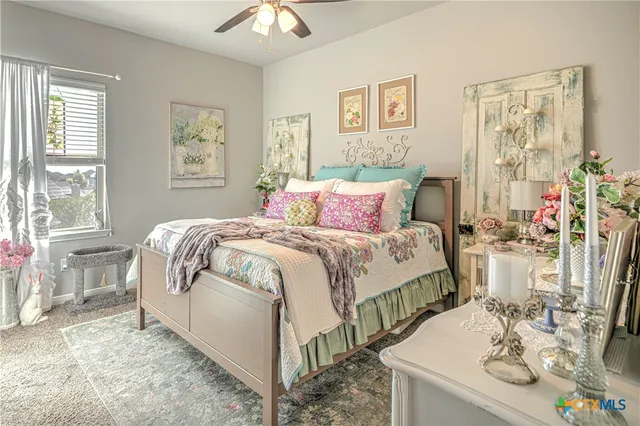 a bedroom with bed and a table