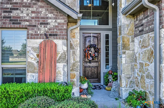 a front view of a house with an outdoor space