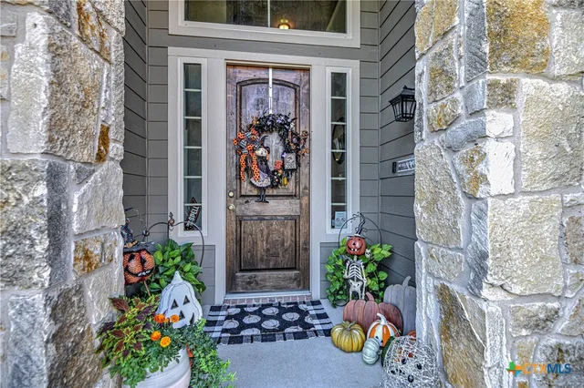 a front view of a multi story residential apartment building with a yard