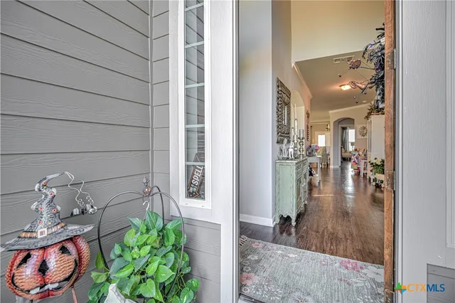 a view of a hallway and dining room