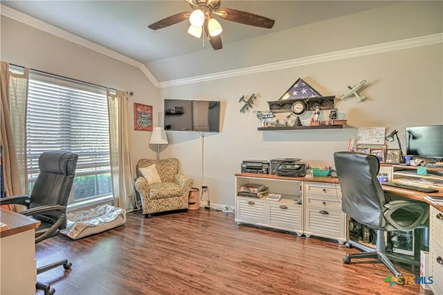 a bedroom with furniture and a window