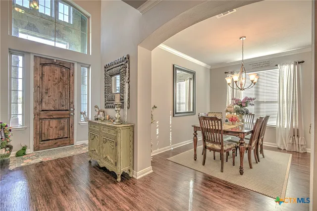 a dining room with furniture window wooden floor
