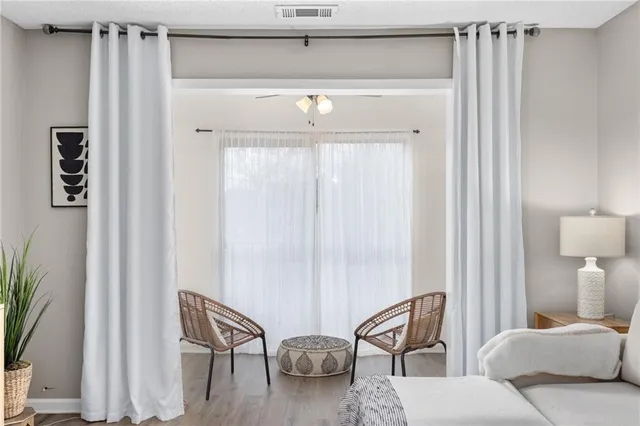 a living room with furniture and a window