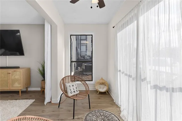 a view of a dining room with furniture and wooden floor