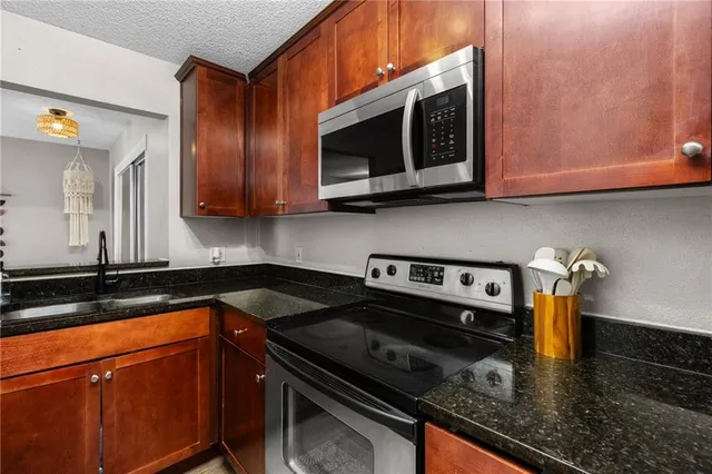 a view of a kitchen from the hallway