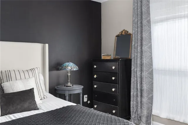 a bathroom with a shower and a toilet