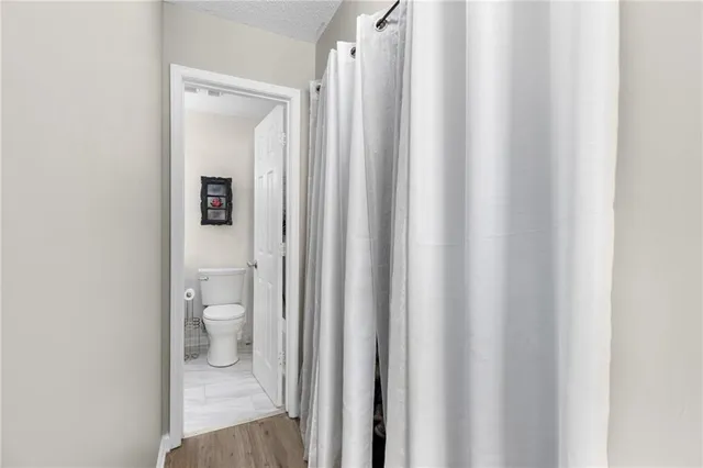 a view of a house with backyard and tree s