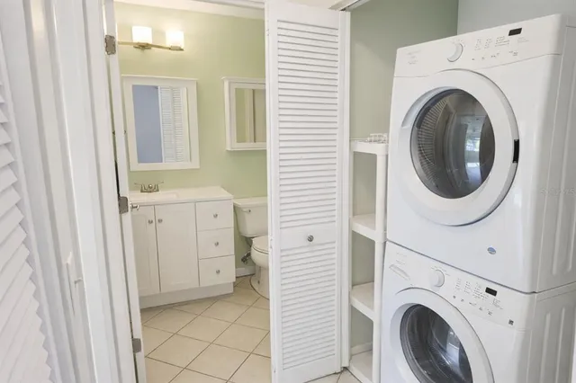 a view of a hallway with washer and dryer