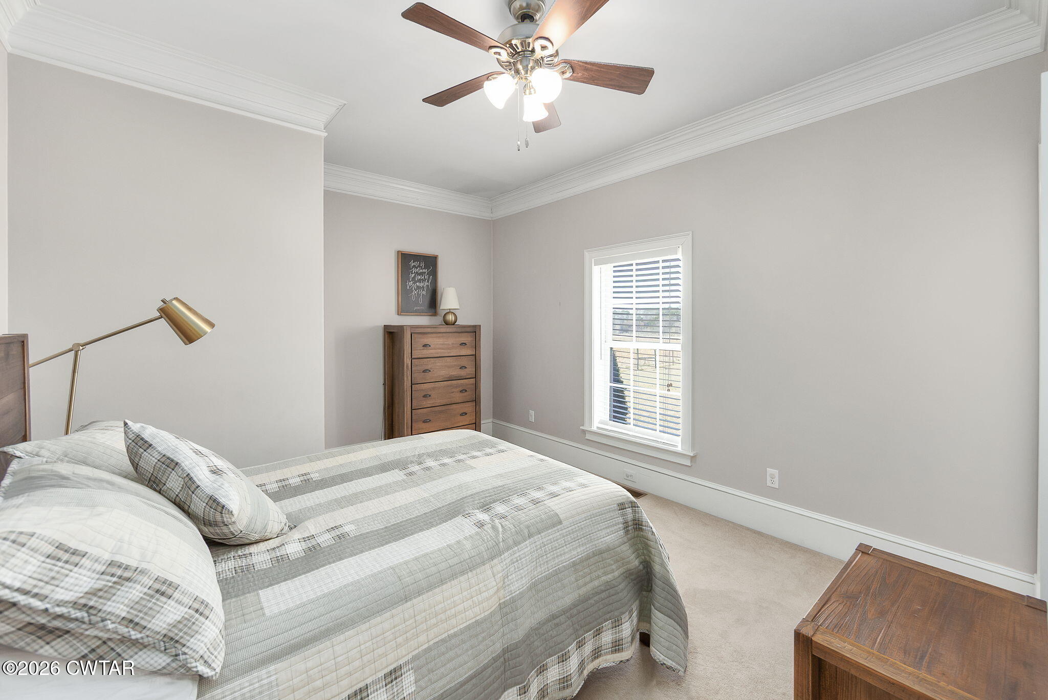 4320 Timberlake-Wildersville Road Lexington, TN 38351 - Photo 20 of 58 a bedroom with a bed and a chandelier