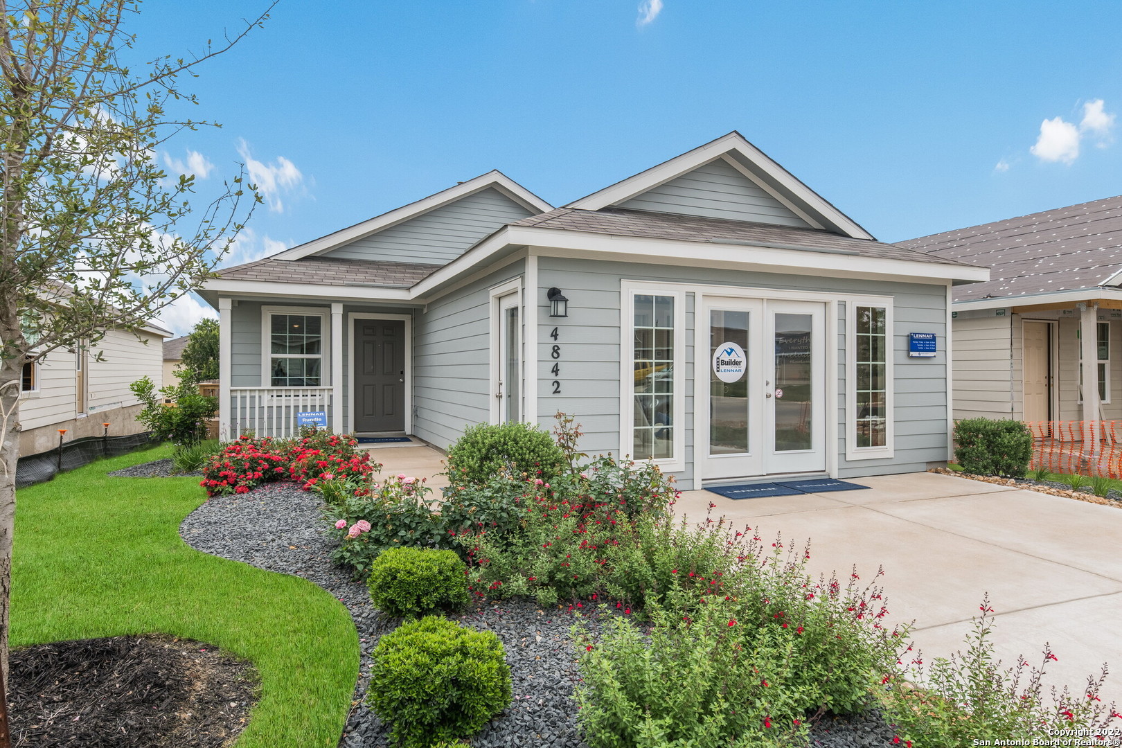 front view of a house with a yard