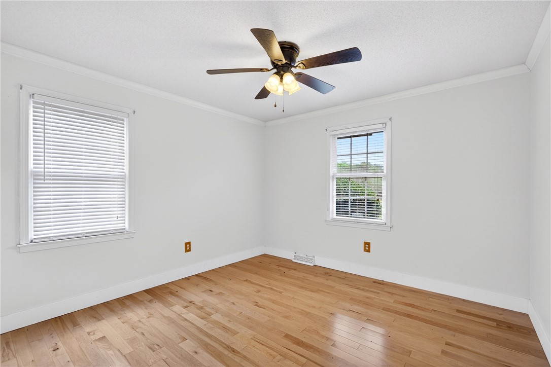 160 Burdette Circle Pendleton, SC 29670 - Photo 25 of 38 This airy bedroom features gleaming hardwood floors and ample natural light.