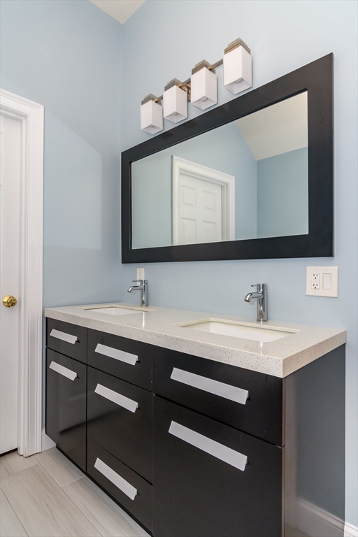 11 Parsons Way Natick, MA 01760 - Photo 13 of 29 a bathroom with a sink and a mirror