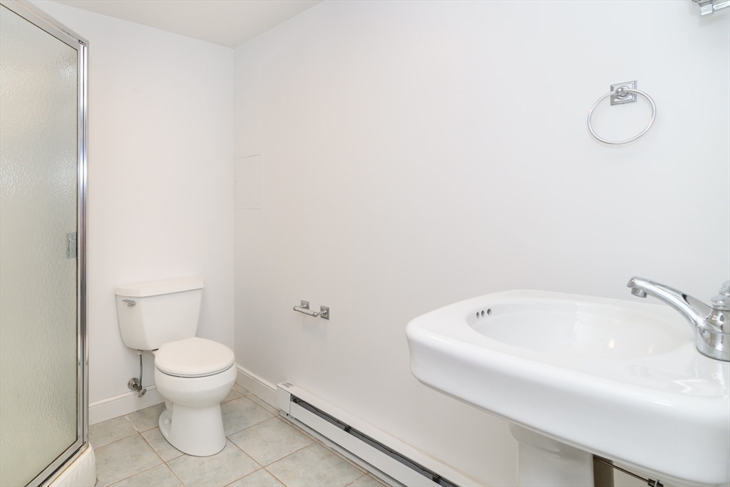 11 Parsons Way Natick, MA 01760 - Photo 20 of 29 a bathroom with a white toilet and a tub