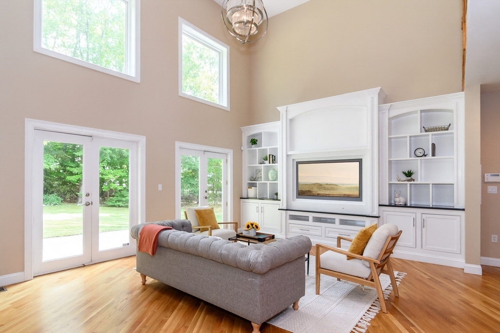 11 Parsons Way Natick, MA 01760 - Photo 2 of 29 a living room with furniture and a large window