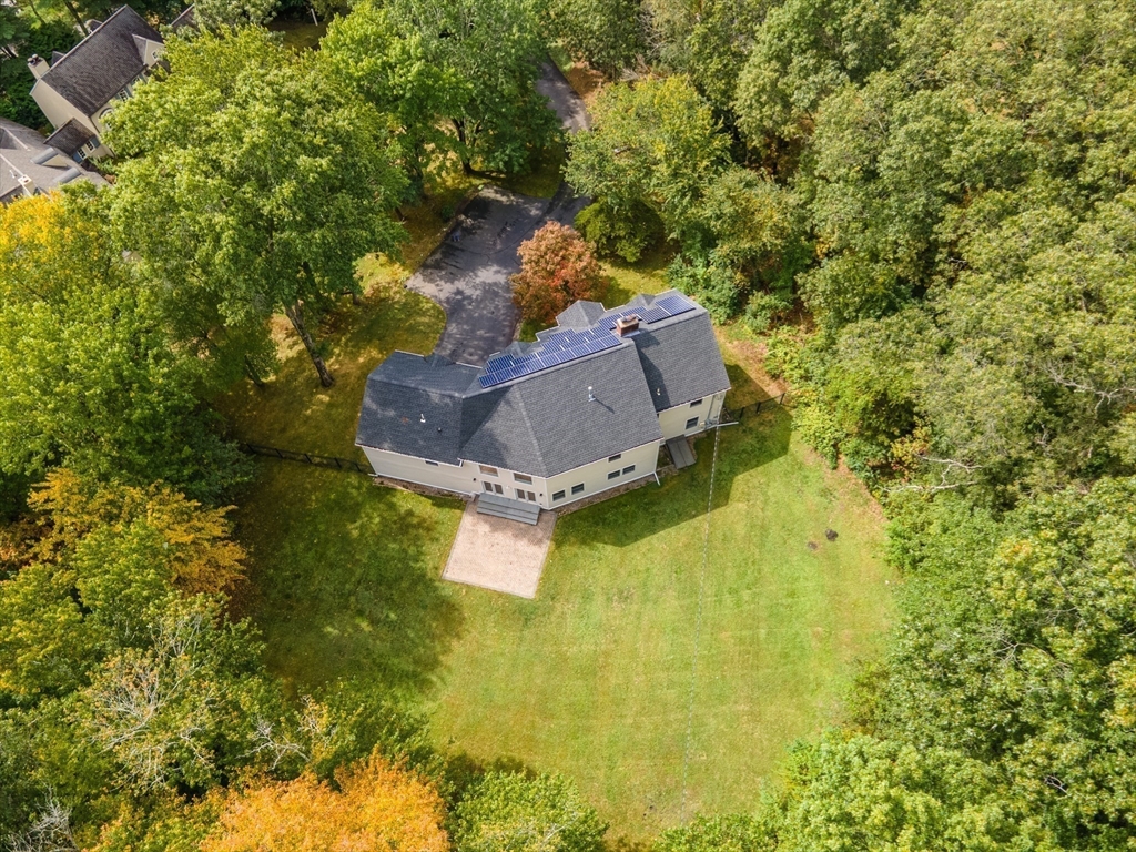 11 Parsons Way Natick, MA 01760 - Photo 24 of 29 a aerial view of a house with swimming pool and large trees