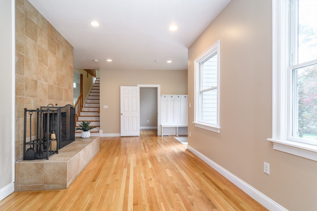 11 Parsons Way Natick, MA 01760 - Photo 7 of 29 a view of empty room with wooden floor and windows