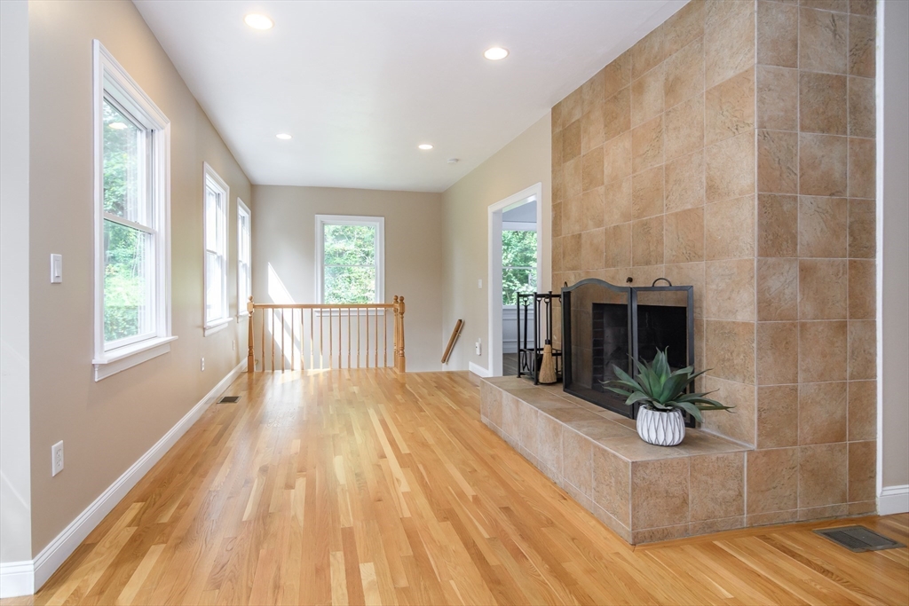 11 Parsons Way Natick, MA 01760 - Photo 9 of 29 a bedroom with a bed and a mirror