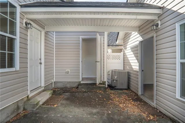 a view of a house with a door and a window