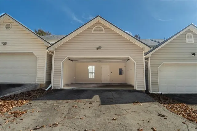 a view of a house with a back yard