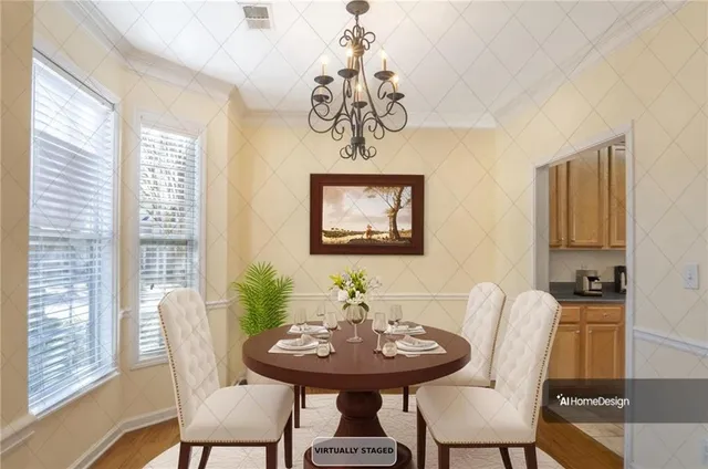 a view of a dining room with furniture and window