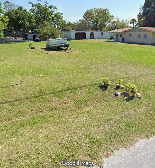 3232 Southeast 34th Avenue Okeechobee, FL 34974 - Photo 3 of 7 a view of a lake with houses