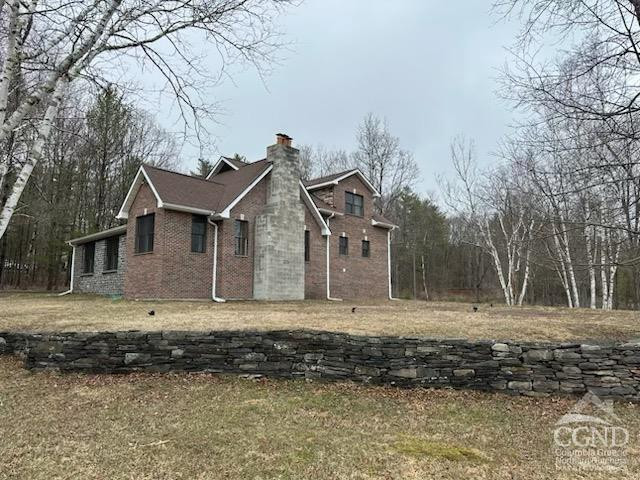 8 Bailey Purling, NY 12470 - Photo 2 of 13 a front view of a house with a yard