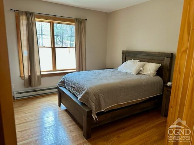 8 Bailey Purling, NY 12470 - Photo 9 of 13 a large bed sitting in a bedroom next to a window