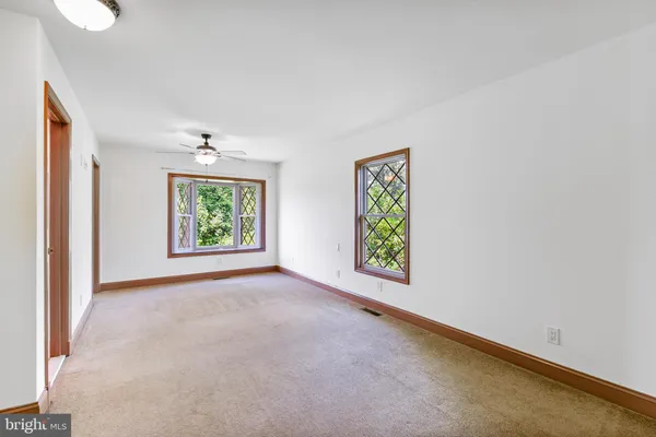 an aerial view of a houses with a lake view